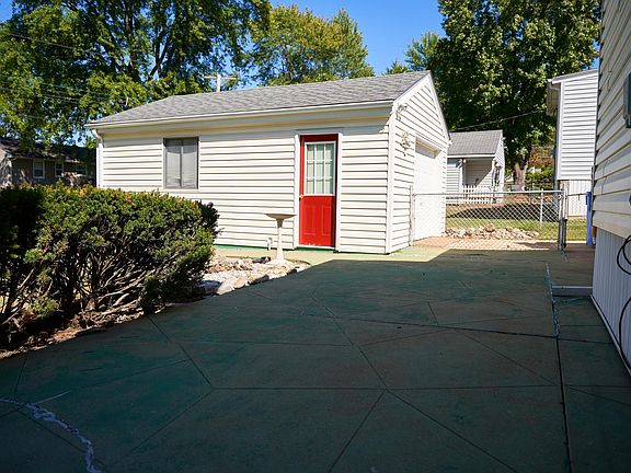 Back patio view, facing driveway and detached garage