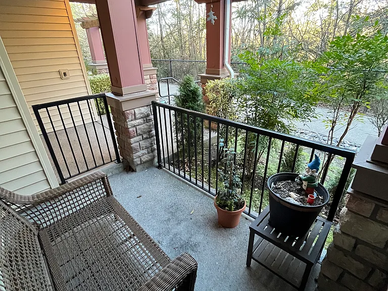 Back patio looking out to protected green space and waterfall area
