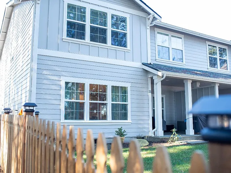 Back side of the house. Note the back deck and large windows above