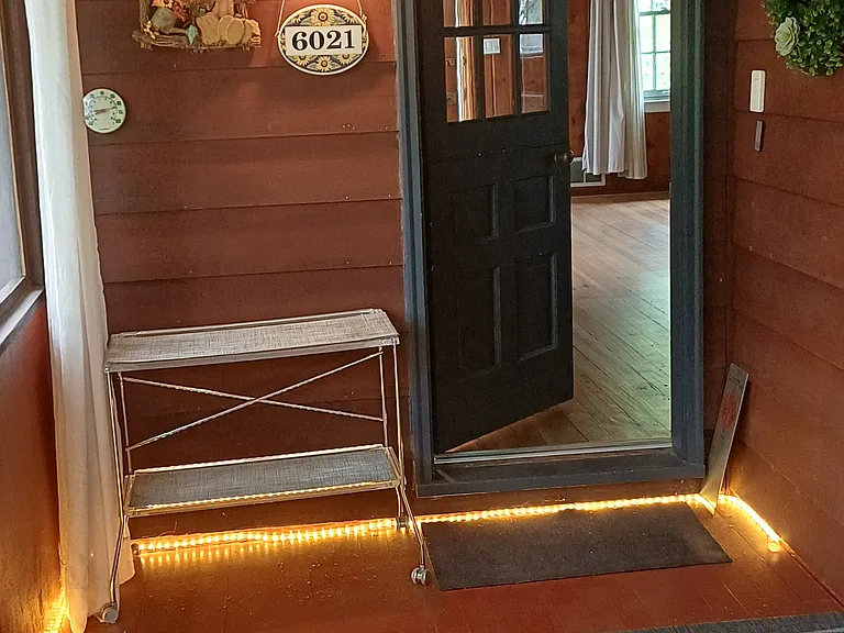 Step back inside from screened porch.
