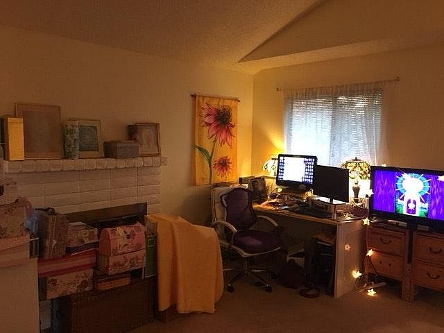 living room: current resident keeps an office in the corner