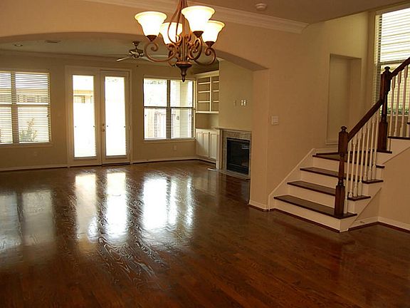 Sample photo- actual finishes may vary. The spacious dining and living areas with gorgeous hardwoods