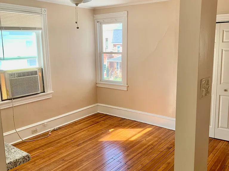 View of spacious dining room with plenty of natural light from kitchen entrance