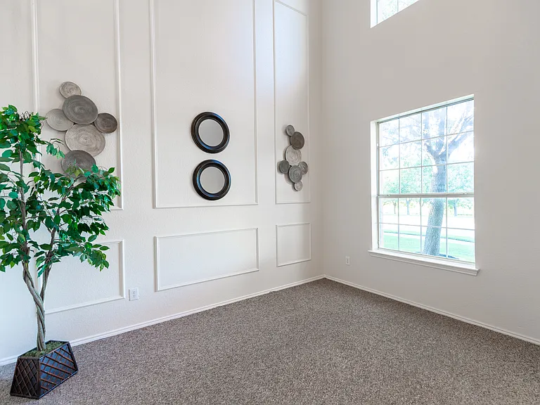Formal living with 2 story ceiling and large windows
