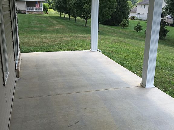 Porch opens to rear lawn