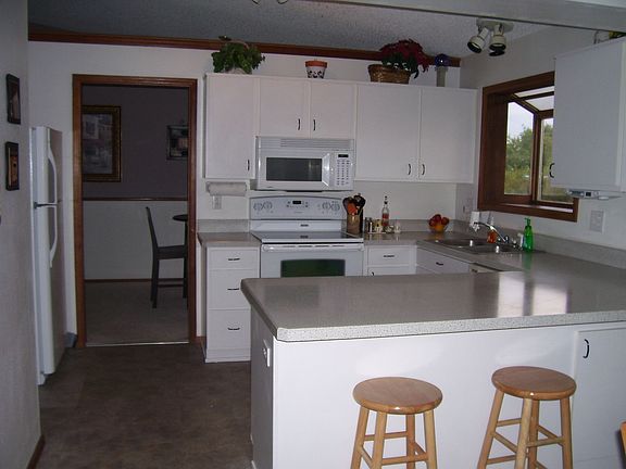 Open, updated kitchen w/ breakfast bar.