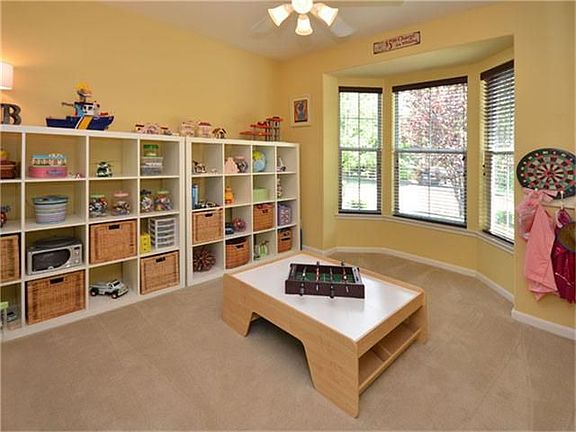 Study with bay window used as a downstairs playroom