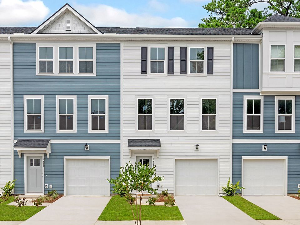 3 level, garage townhomes with blue white exteriors in a DRB Homes Brookgreen model home at Park C