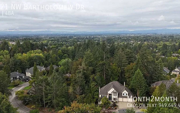 9021 NW Bartholomew Dr — Photo 40