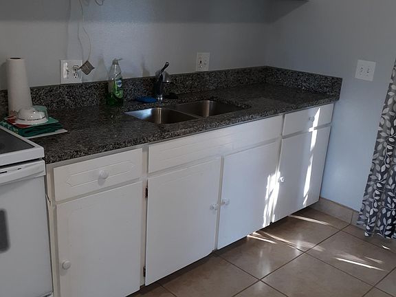 Kitchen: stainless steel sink with granite counter tops & garbage disposal. Plenty of cupboard space.