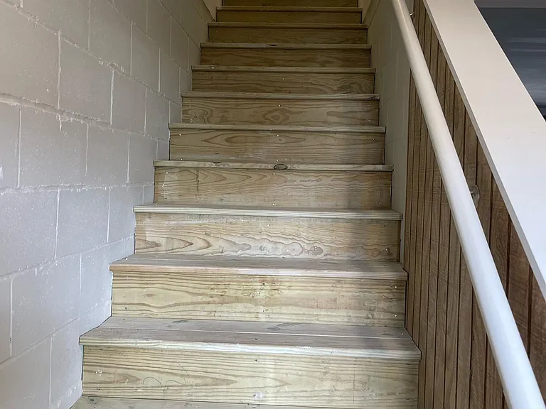 The stairs from garage up to main level