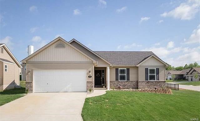 Welcome to 445 Gerber Drive. This home sits on a large, fenced, corner lot toward the back of the su