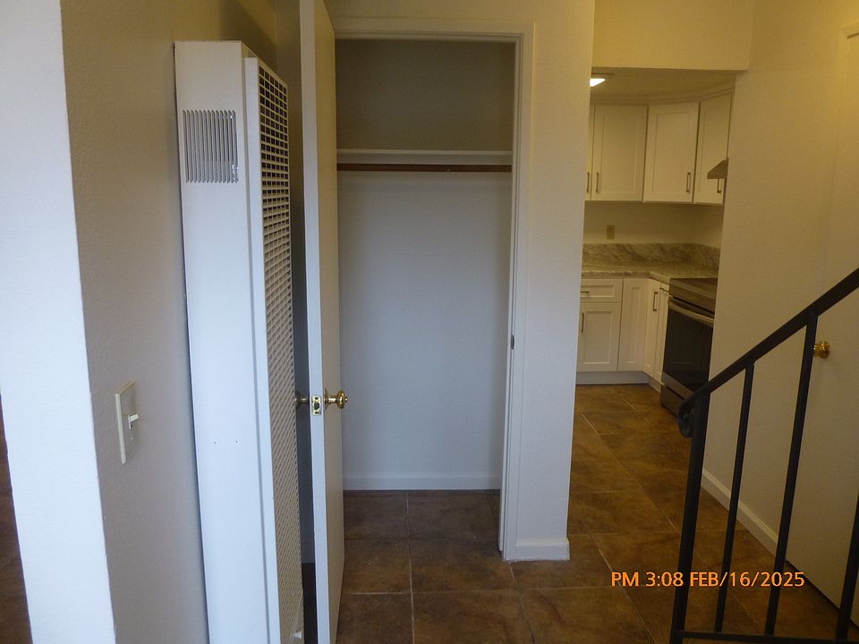 From front door looking into entry way with closet door open