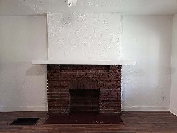 Livingroom faux fireplace, hearth & mantel.