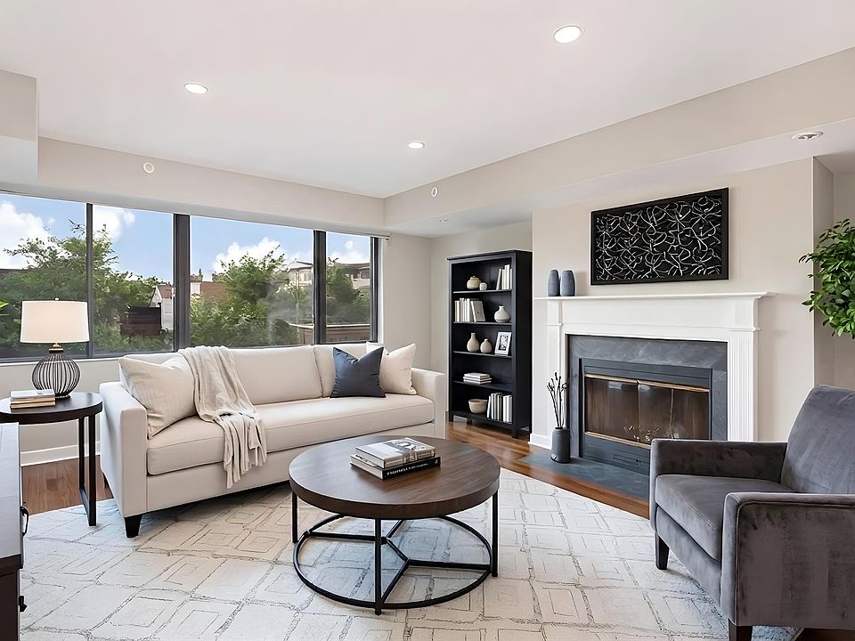 1633 Q living area with fireplace (virtually staged)