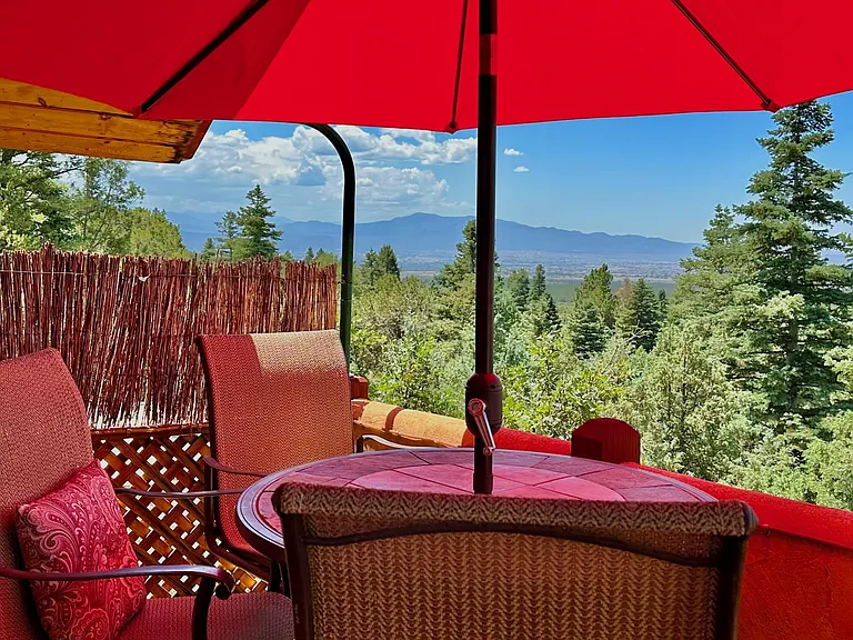 The upper balcony off the main bedroom looking to the Southwest with Truchas Peak (13,102') at 40 miles distance.