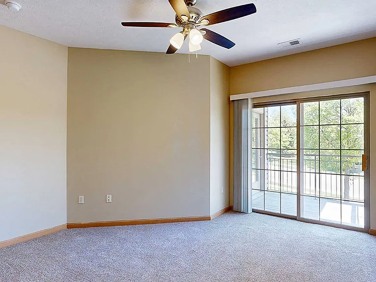 The primary bedroom of the 3-bedroom Raven features a private balcony.