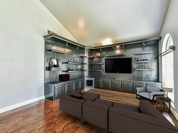 Versatile Room Can Be A Formal Living Or Dining Room With Immaculate Wood Floors and Built In Shelving
