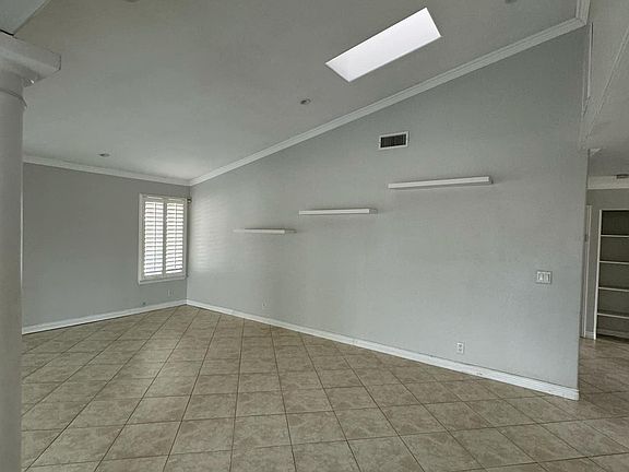 Open living room w/ skylights