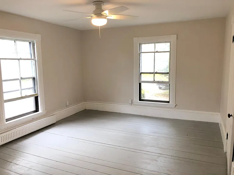 Primary bedroom with lots of light.