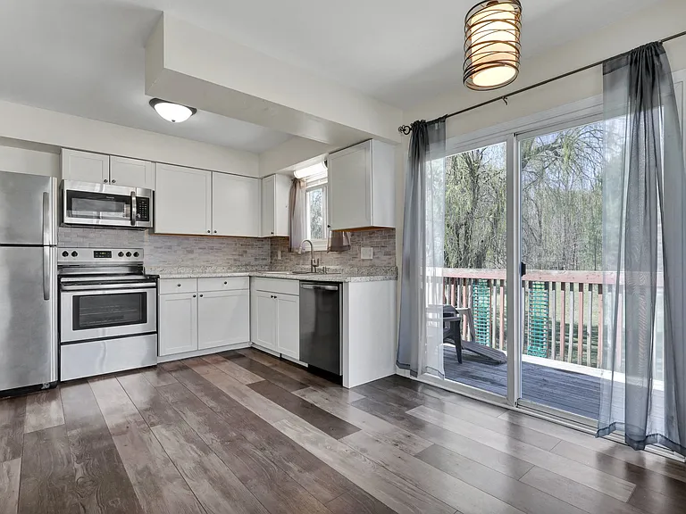 Kitchen + dining room + small balcony