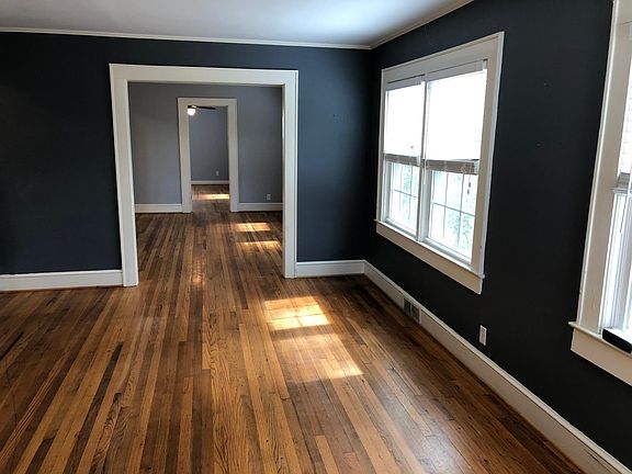 Wood floors throughout living, dining, and bedrooms. 
