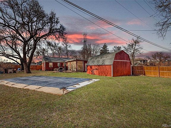 Backyard with 384 sq. ft. storage barn and non-functional in-ground swimming pool