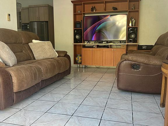 Main living room area connected to front door balcony
