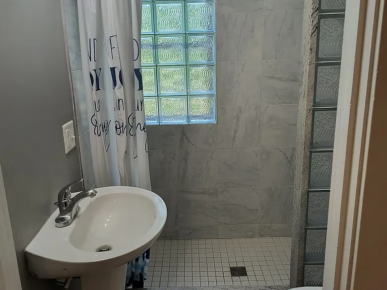 Full bathroom with shower.