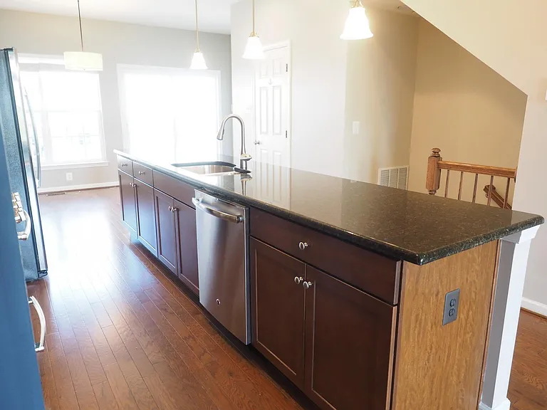 More cabinets flanking the dishwasher.