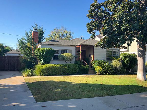 Front view plus driveway.