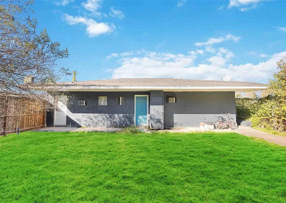 Shared lawn for kids and pets.. Secured and closed with a side gate