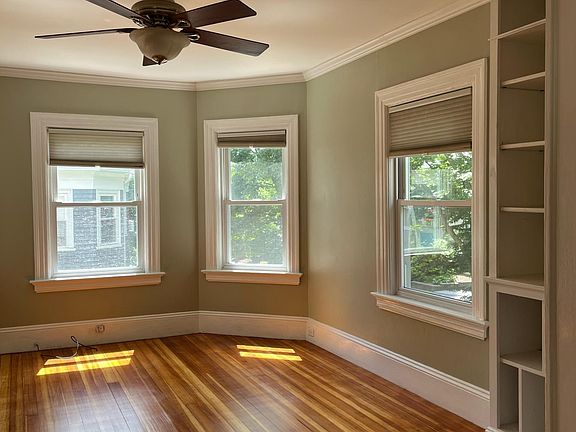 2nd floor living room with built in shelving.