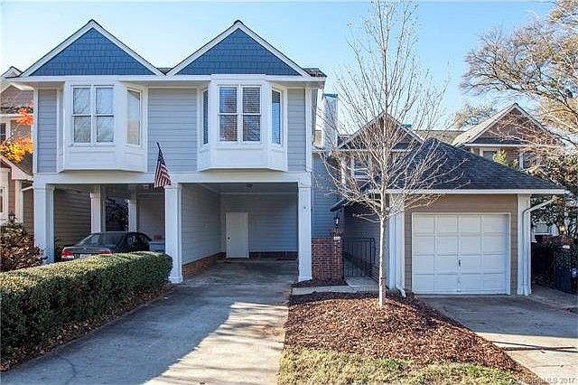Townhome exterior with 2-car driveway