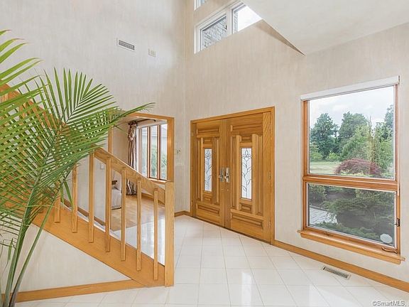 Dramatic double door entry welcomes you into the sun-filled interior!