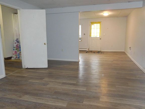 Open concept living room opening to the kitchen