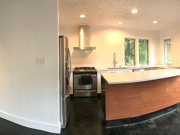 Stretchy to capture whole kitchen. French doors to patio.