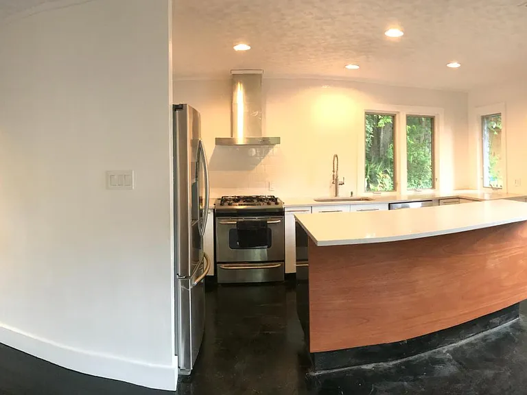 Stretchy to capture whole kitchen. French doors to patio.
