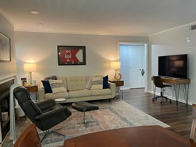 Living area with view to hallway to bedrooms.