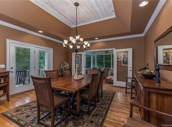 Access to open deck and screened patio from dining room make this home perfect for entertaining.  Tray ceiling add to the beauty of space