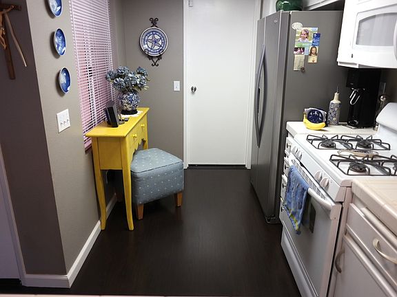 Kitchen includes gas stove, microwave, & dishwasher