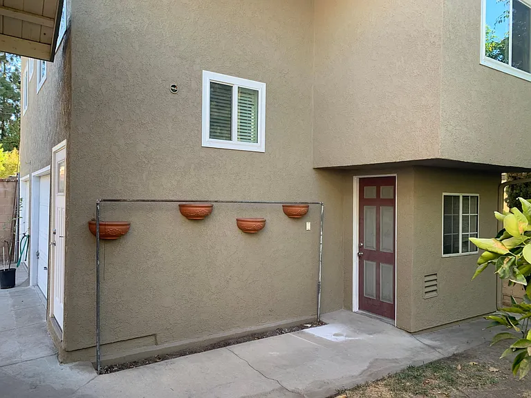 Door on Right leads to the laundry room with full private storage.