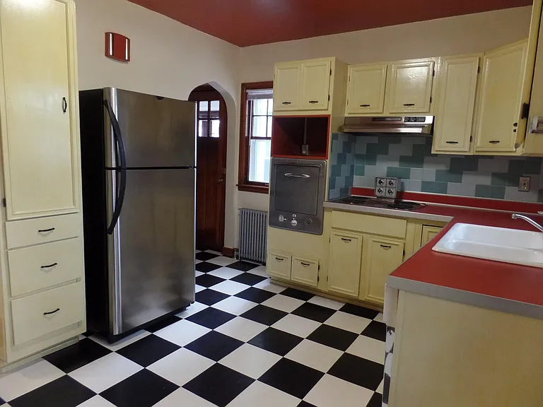 Kitchen. Entryway leads to a small landing. Go right to the Three Season Porch. Go left go go to the Basement.