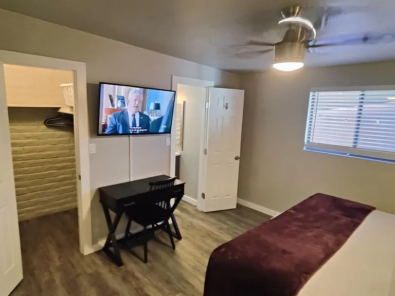 Master bedroom showing half bath and walk in closet