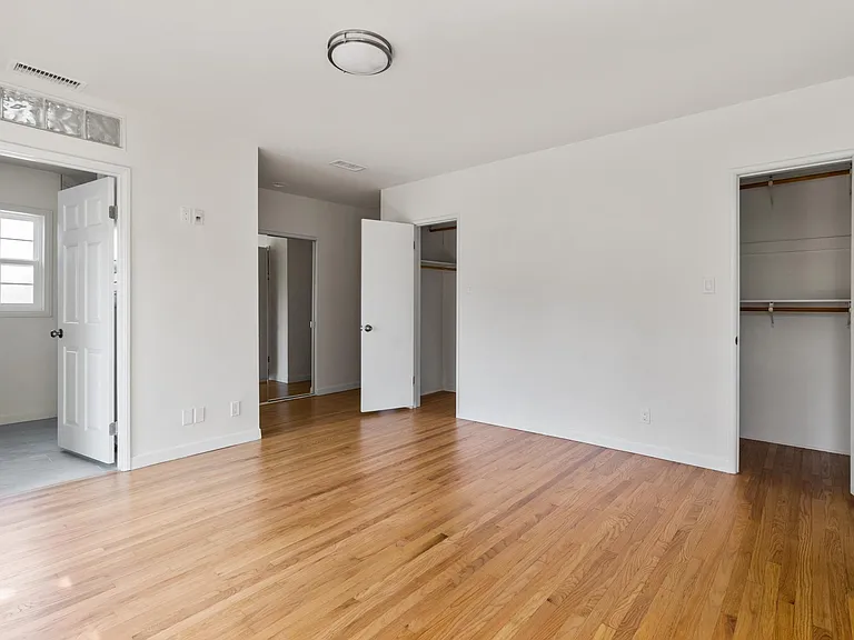 Large ensuite master bedroom with three closets
