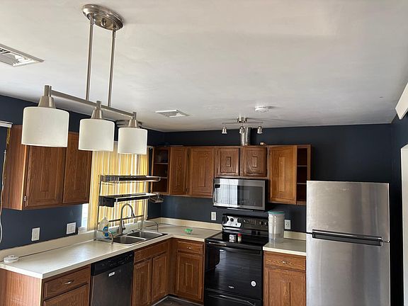 Kitchen with new Microwave, Whirlpool Refrigerator, Dish washer, Range