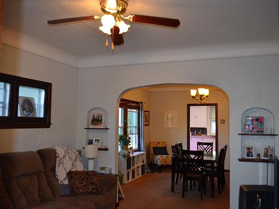 Original woodwork and archways throughout the unit.