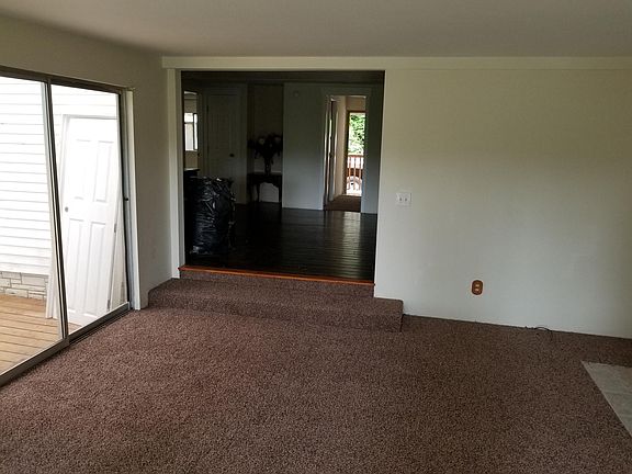 Living Room with Adjoining Partially Covered Deck