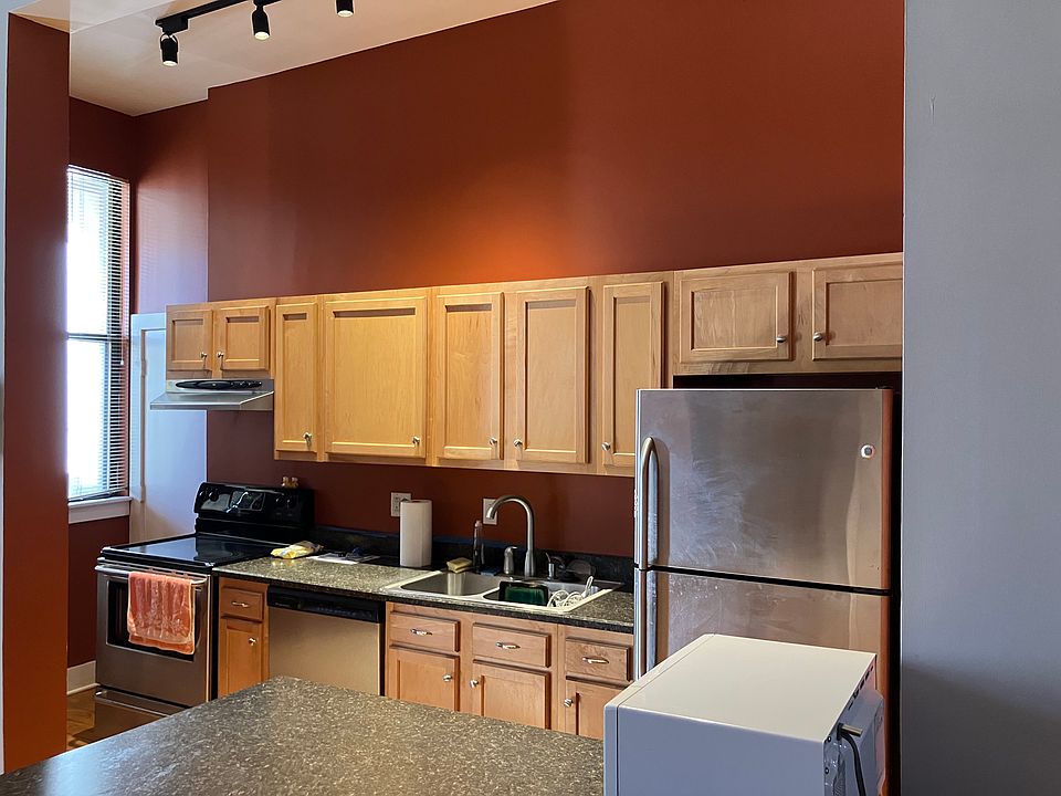Kitchen, showing microwave, refrigerator, dishwasher, and stove.