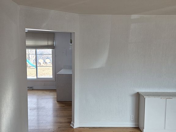 Living Room moving into Dining Area and Kitchen